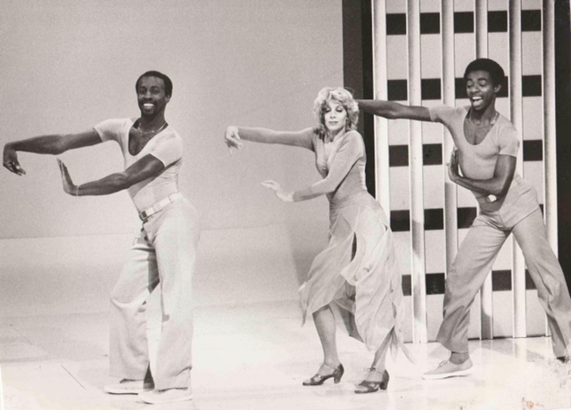 Bruce Heath and dancers in mid strut on the set of a 1970s television show